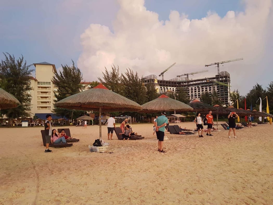 Tourists on a CNMI beach