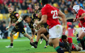 Hurricanes' Julian Savea runs the ball .