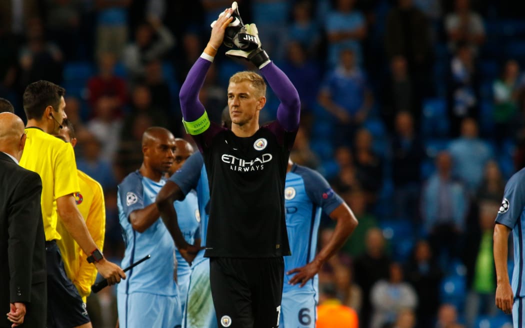 Manchester City goalkeeper Joe Hart applauds the crowd following his side's win in the Champions League.