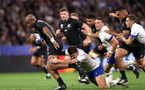 Mark Telea is tackled by Luca Morisi during the Rugby World Cup France 2023 match between the All Blacks and Italy at Parc Olympique