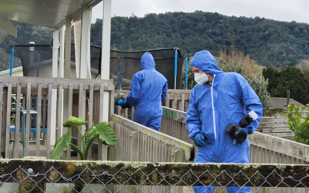 Police can be seen executing a search warrant at a Taraire Street property in Kaikohe following the death of Linda Woods on 1 June.