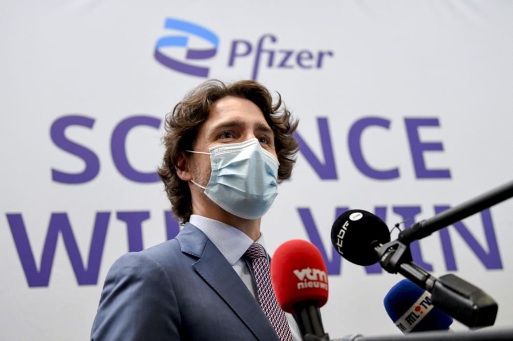 Canada's Prime Minister Justin Trudeau talks to the press at the end of a visit with his Belgian counterpart of Europe's largest Pfizer-BioNTech Covid-19 vaccine production site.