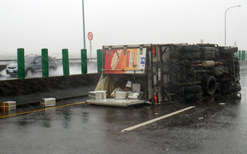 A truck is overturned as typhoon Meranti slashes southern Taiwan.