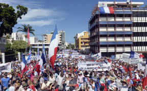 People take part in a demonstration on April 24, 2015 in Noumea, New-Caledonia, called by two right wing UMP affiliated parties to codemn the French Governemnt policy about New-Caledonia forced march towards independance.