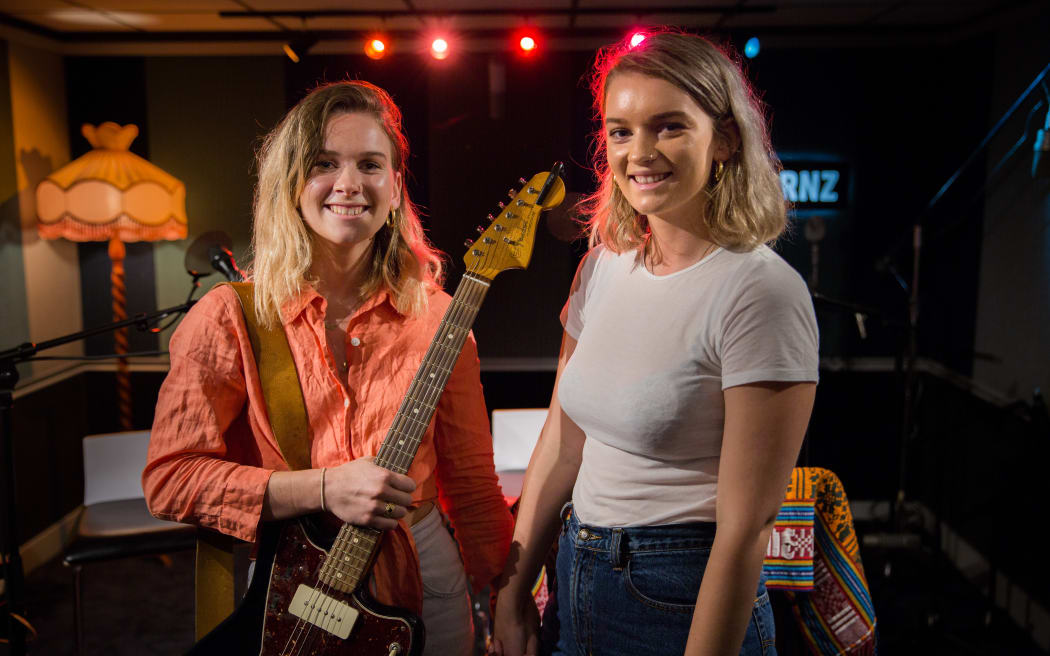 Georgia Nott and her sister Nika (Olivia) in the RNZ Auckland Studio for a live session playing songs from her new solo album under the name The Venus Project.