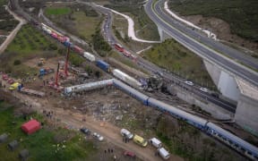 This aerial drone photograph taken on 1 March 2023, shows emergency crews searching wreckage after a train crash in the Tempi Valley near Larissa, Greece.