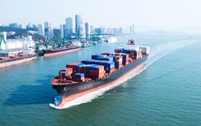 Large container ship arriving in port.