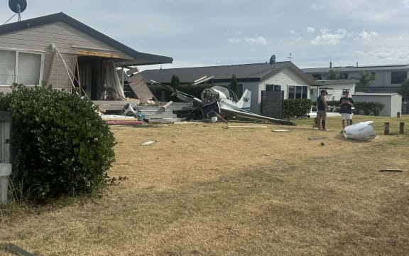 A small aeroplane crashed into a house on Pauanui's Harvard Court, next to the Pauanui Airfield, on the morning of Christmas Day, 2025.