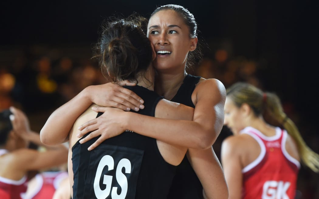 Maria Tutaia hugs Jodi Brown after a dramatic 1 point win over England in the Netball Semi Final match. Glasgow Commonwealth Games