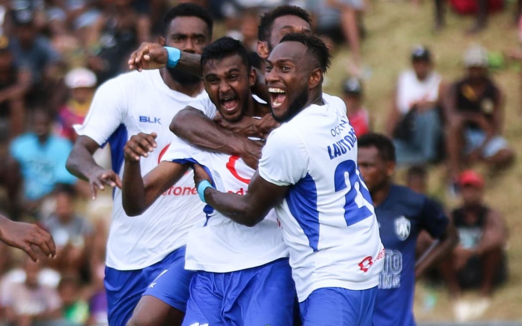 Lautoka's Praneel Naidu (c) celebrates his goal with teammates.