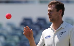 This file photo taken on November 21, 2015 shows New Zealand's Matt Henry preparing to bowl with the pink ball on day one of the tour cricket match between New Zealand and Western Australia in Perth.