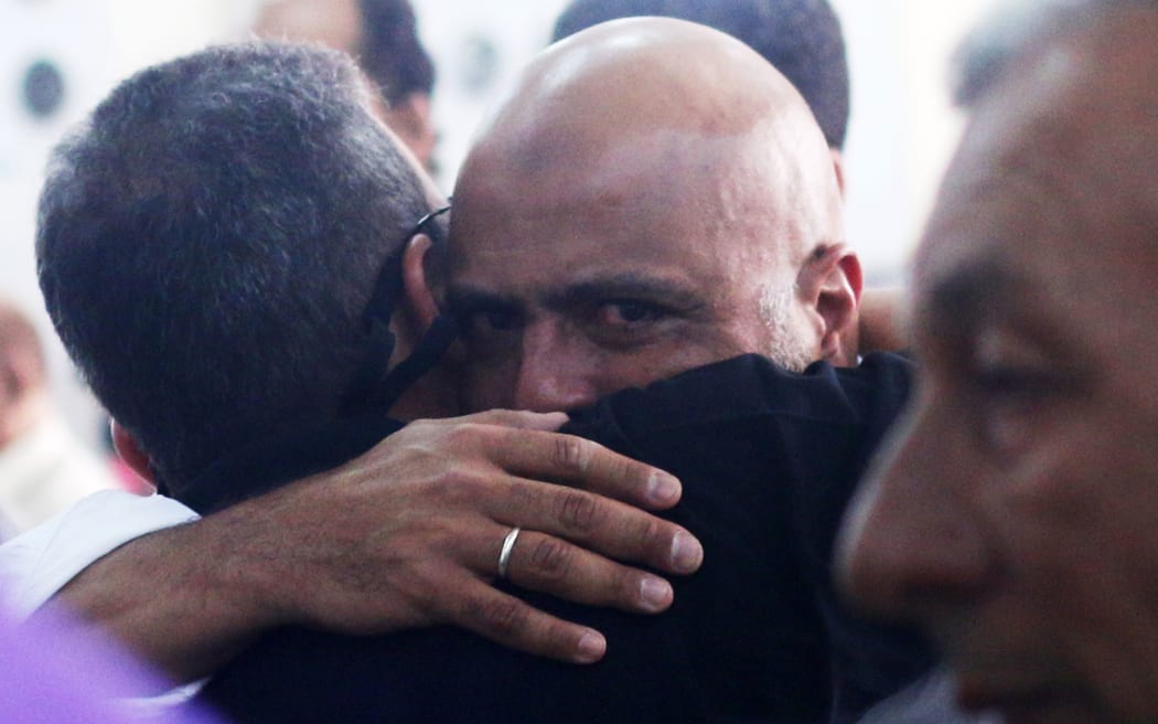 Relatives and friends of passengers of the EgyptAir plane that crashed in the Mediterranean, comfort each other on May 20, 2016 during prayers at Abou Bakr el-Sedek mosque in Cairo.