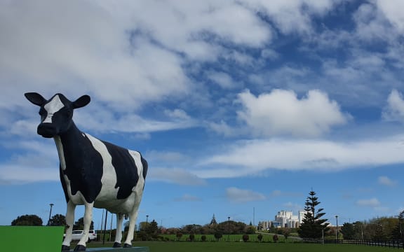 Fonterra's Whareroa plant behind a symbolic dairy cow near Hawera