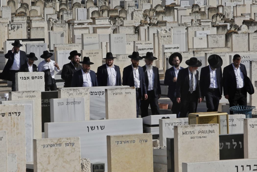 Ultra-Orthodox Jews attend the funeral of one of the victims of Meron stampede at Segula cemetery in Petah Tikva on April 30, 2021.