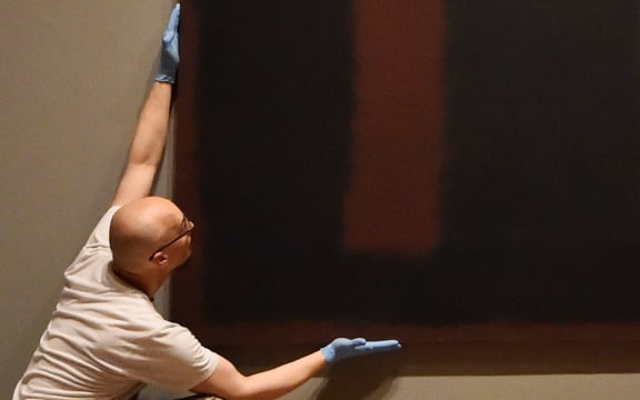 Mark Rothko's 'Black on Maroon'  has gone back on display at the Tate Modern in London.