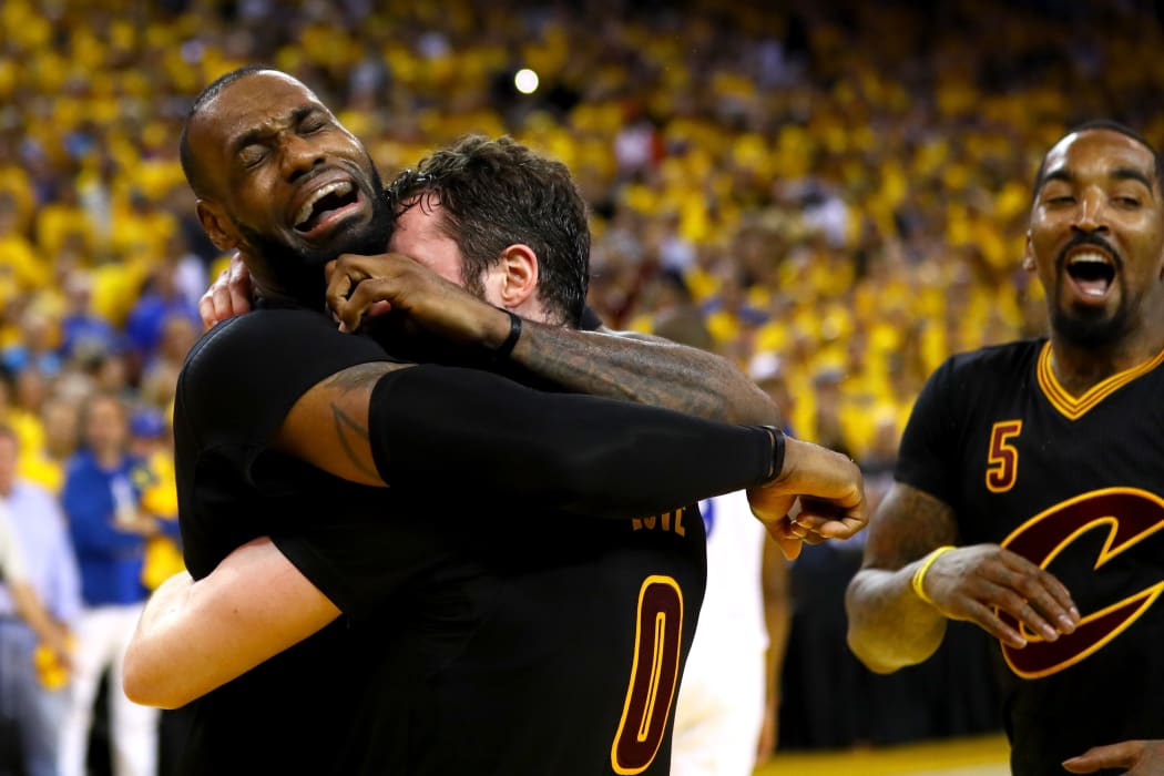 LeBron James and Kevin Love of the Cleveland Cavaliers celebrate after defeating the Golden State Warriors in the NBA final on 20 June 2016.