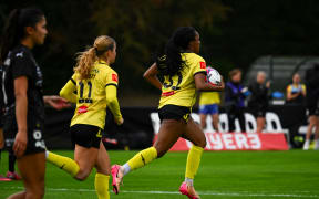 Makala Woods of the Wellington Phoenix runs ball back to half way after scoring.