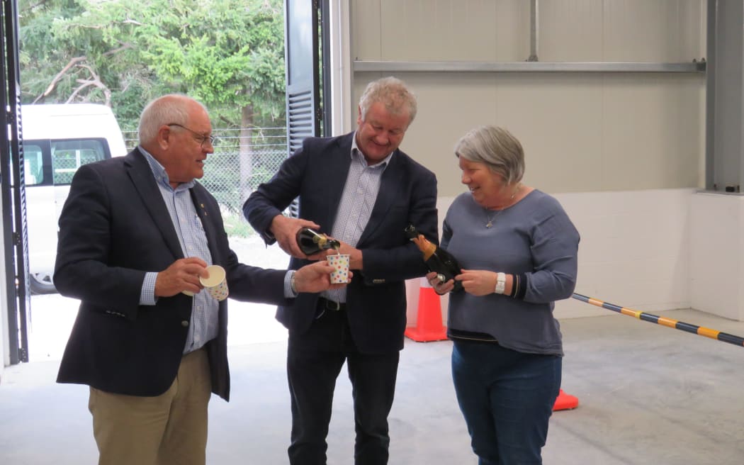 Methven Community Board chairperson Kelvin Holmes, Mayor Neil Brown and deputy mayor Liz McMillan toasting the opening of Methven's new water treatment plant - a very happy occasion for McMillan as she knew she would no longer have to answer for boil water notices.