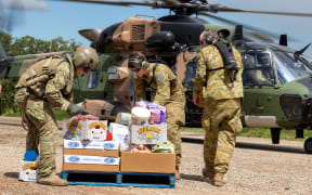 Australian Army soldiers loading crates of fresh food, ready for delivery to areas of northern New South Wales affected by floods on 4 March 2022.