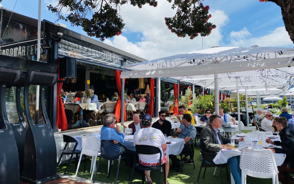 Aucklanders eat out at the Viaduct on the first day of the traffic light system