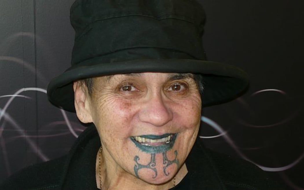 Ngahuia Te Awekotuku  with moko and wearing black hat