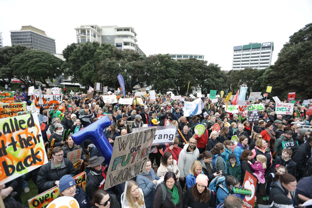 The teachers' strike march reaches Parliament.