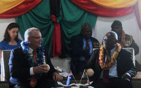 Australian PM Scott Morrison is greeted by Vanuatu President Obed Tallis at the State House.
