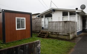 About thirty-five workers are crammed into this three-bedroom house in Papakura.