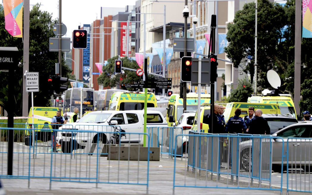 A number of ambulances at the scene of a fatal shooting incident in downtown Auckland on 20 July, 2023.