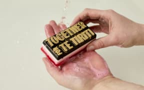 Lush’s 'Together for Te Tiriti' soap was developed in collaboration with ActionStation and tāngata whenua, with its design inspired by the Tino Rangatiratanga flag’s colours - with the support of Linda Munn. The tohu (symbol) was created by Extended Whānau.