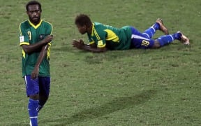 Dejected Solomon players after their loss to PNG in the OFC Nations Cup semi-final 2016