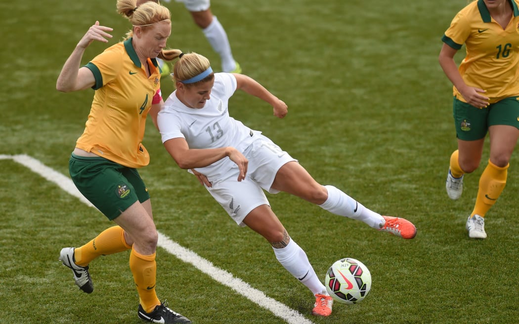 Rosie White contests the ball against Australia's Matildas at Bill McKinlay Park, February 2015
