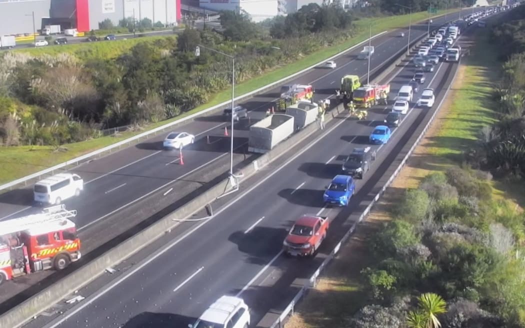 A truck has crashed into a barrier on Auckland's Northwestern motorway at Whenuapai.