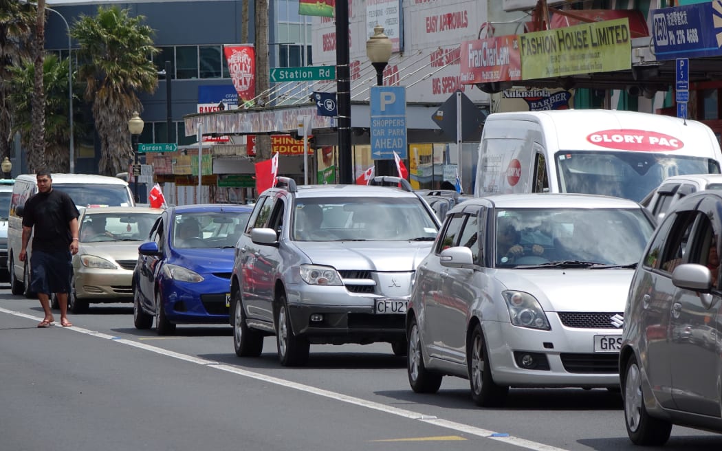Cars display the Tongan flag on Great South Road.