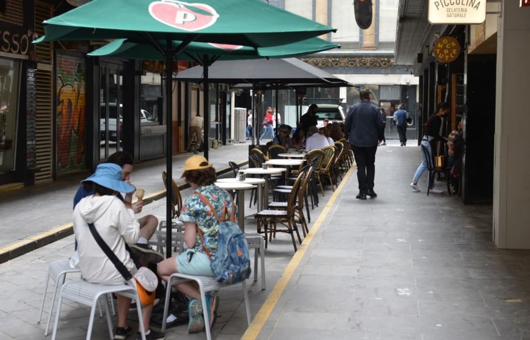 MELBOURNE, AUSTRALIA - OCTOBER 22: People are seen spending their time at a cafe after Covid-19 lockdown ended in Melbourne, Australia on October 22, 2021.