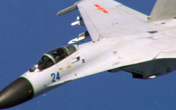 This image, obtained on August 22, 2014, shows a Chinese fighter jet in a photo taken by a US Navy P-8 crew.