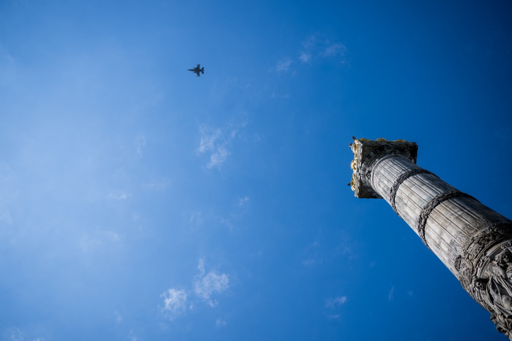 A picture of a F-16 fighter jet taken during the commemoration ceremony of the 80th anniversary of the end of the Second World War in Europe, at the Tomb of the Unknown Soldier, in Brussels, Thursday 08 May 2025. Exactly 80 years ago, on May 8, 1945 at 3:00 pm, the European population learned that the Second World War was coming to an end. The German army signed their capitulation the night before and the Allies were victorious. BELGA PHOTO JASPER JACOBS (Photo by JASPER JACOBS / BELGA MAG / Belga via AFP)