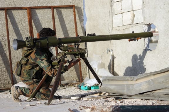 A rebel fighter with a rocket launcher in Aleppo.