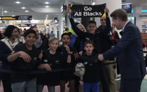 Fans waiting for the All Blacks at Auckland Airport ahead of 2015 Rugby World Cup.