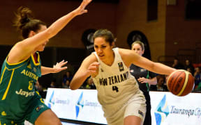Kalani Purcell of the Tall Ferns dribbles the ball with Tess Madgen of the Opals during the Oceania Championship for Women basketball match between New Zealand and Australia at the ASB Baypark Events Centre in Tauranga on Monday the 17th August 2015. Copyright Photo Marty Melville / www.photosport.nz