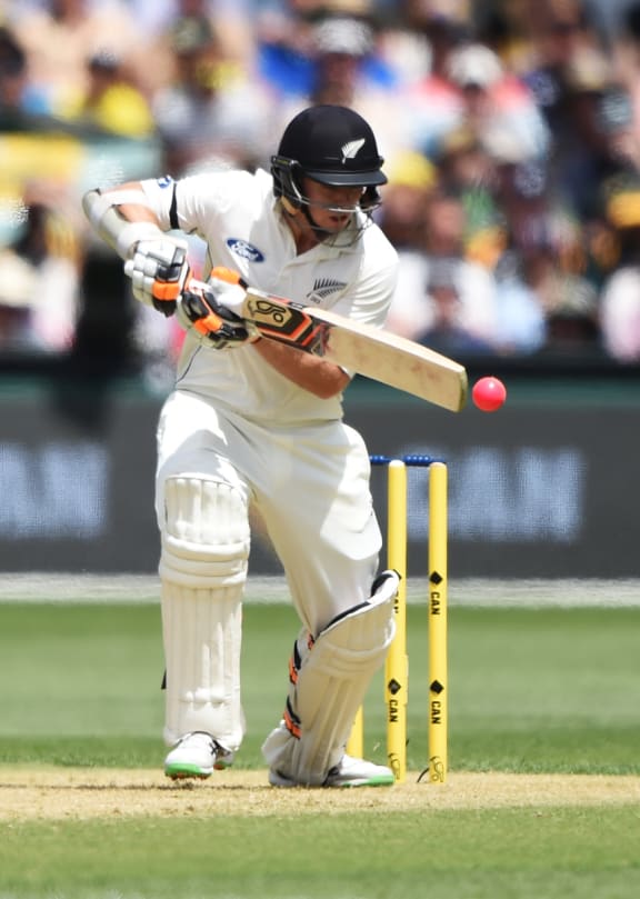Eyes on the ball: Tom Latham is attentive on his way to a half century on Friday.
