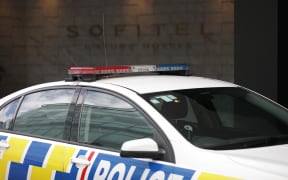 A police car outside the Sofitel in Auckland's Viaduct Harbour.