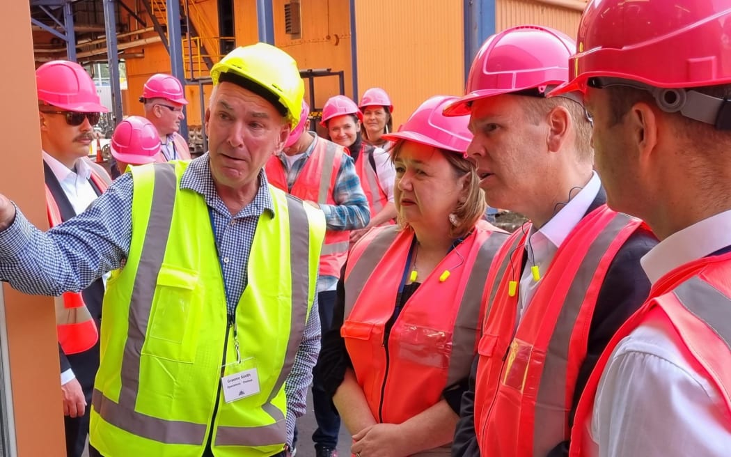 Prime Minister Chris Hipkins (third left) and Minister of Energy and Resources Megan Woods (second left) visiting the Auckland-based Chelsea Sugar Factory on 20 April 2023.