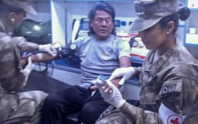 Peruvian fisherman Maximo Napa, 61, receiving medical attention upon arriving in Paita, Peru.