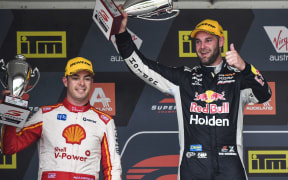 Shane van Gisbergen celebrates winning race one of the 2018 Supercars round at Pukekohe ahead of fellow Kiwi driver Scott McLaughlin.