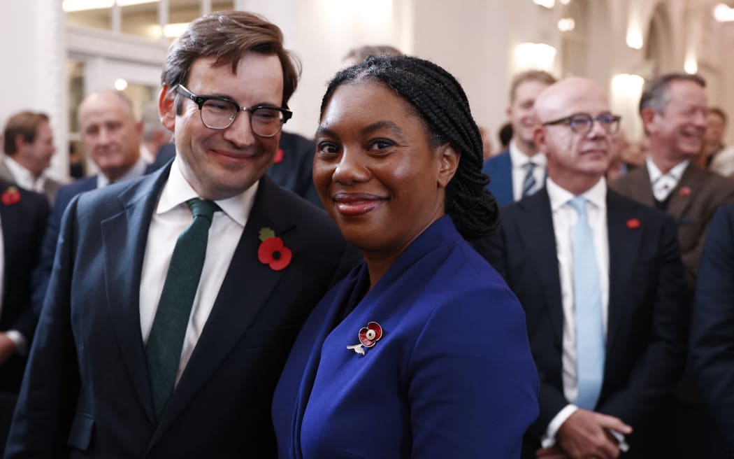 New leader of Britain's main opposition Conservative Party, Kemi Badenoch smiles beside her husband Hamish (L) after being announced as their new leader, in London on November 2, 2024. - The UK's Conservative Party announced on Saturday that Badenoch is its new leader, now facing the daunting task of reuniting a divided and weakened party whose 14-year rule ended with July's crushing election defeat. (Photo by BENJAMIN CREMEL / AFP)