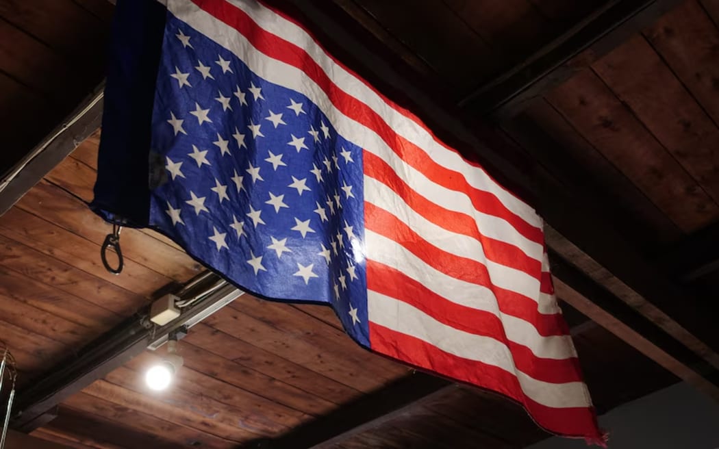 An American flag hangs upside down at the Binalong cafe.