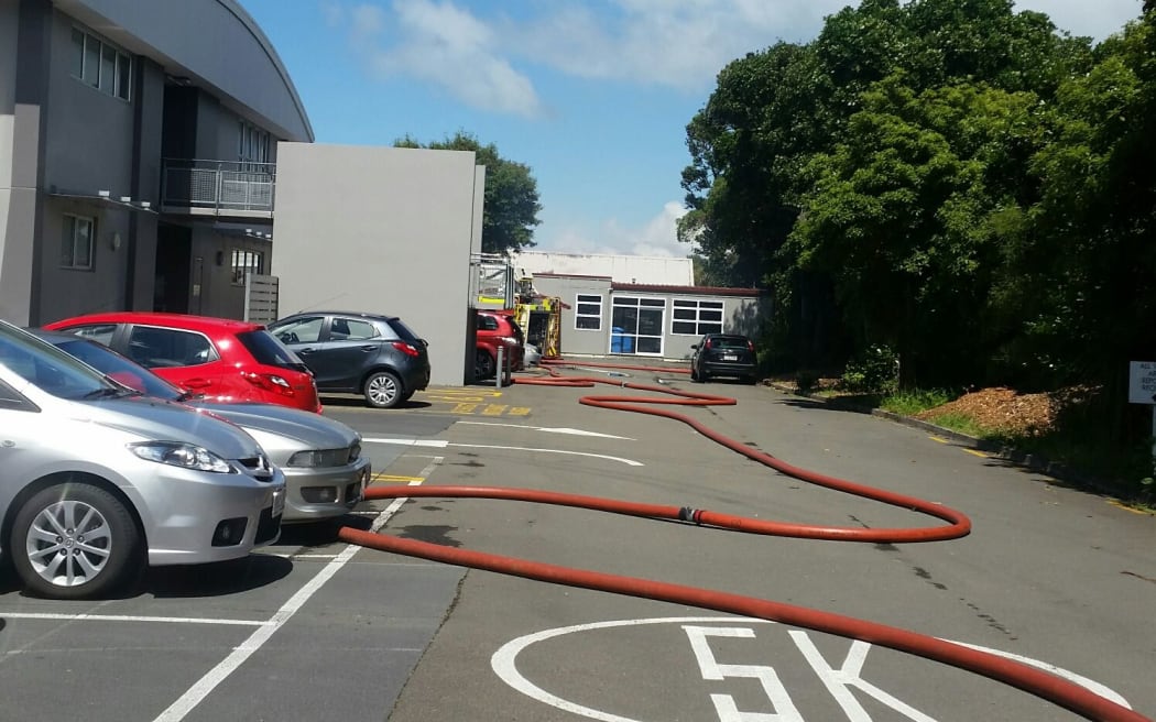 A firehose winds its way through the school.
