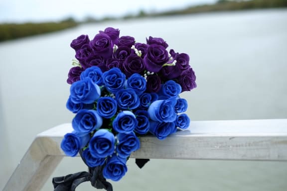 Flowers at Parakai Wharf, from where the Francie set off on Saturday morning.