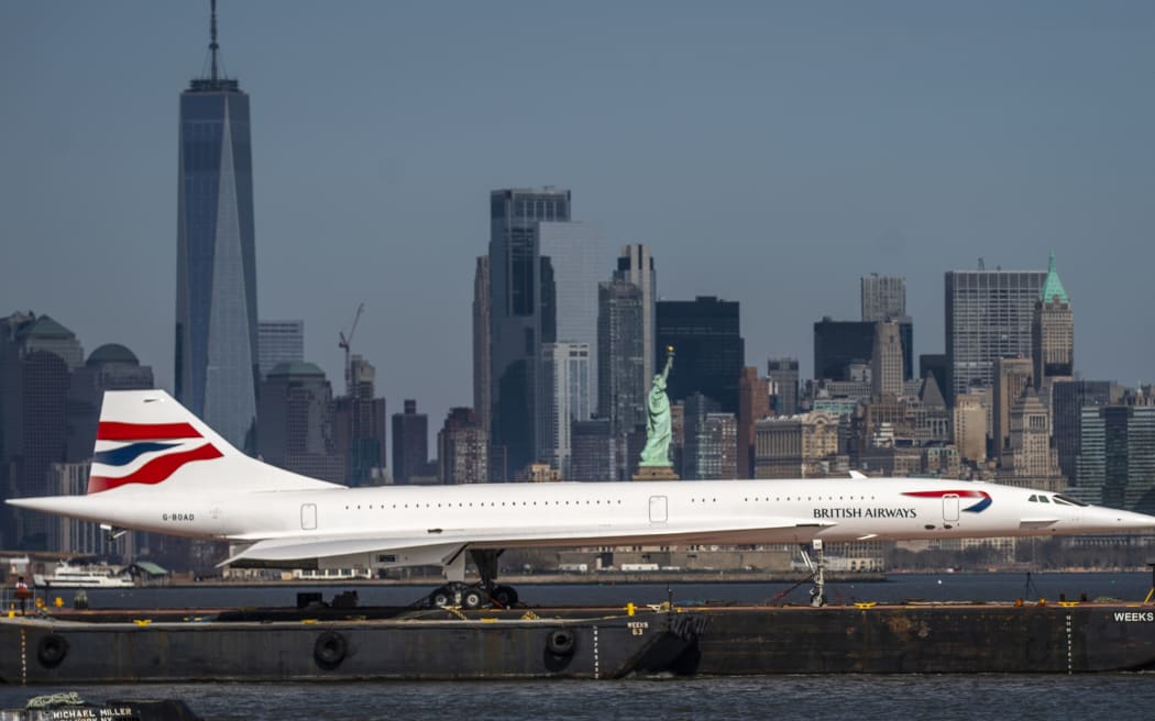 BAYONNE, NEW JERSEY - MARCH 13: A retired British-Airways Concorde supersonic airliner is moved on a barge up the Hudson River on March 13, 2024 seen from Bayonne, New Jersey. The Concorde, one of a fleet of seven once owned by British-Airways, departed the Brooklyn Navy Yard following a months-long restoration project at the GMD Shipyard en route to the Weeks Marine in Jersey City, N.J. for overnight storage before it is returned to the Intrepid Museum.  (Photo by Eduardo Munoz Alvarez/Getty Images)